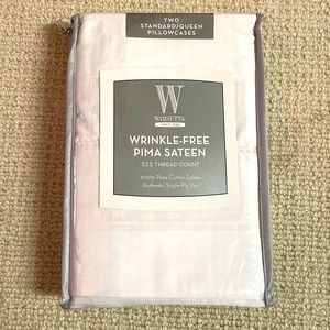 Two standard/queen pillowcases.Brand new in package!
